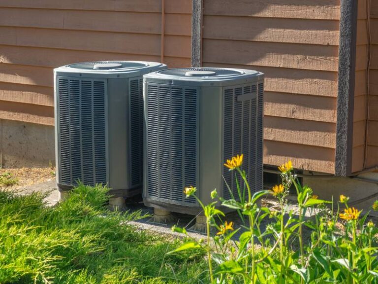 Air conditoner surrounded by grass resized