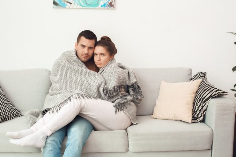 young couple cold in blanket