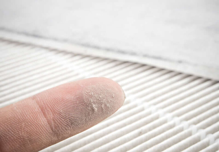 dust on finger ac filter compressed